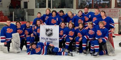 A team of hockey players ready to hit the ice in Saskatchewan, transported safely by Paradigm Charter Bus Lines.
